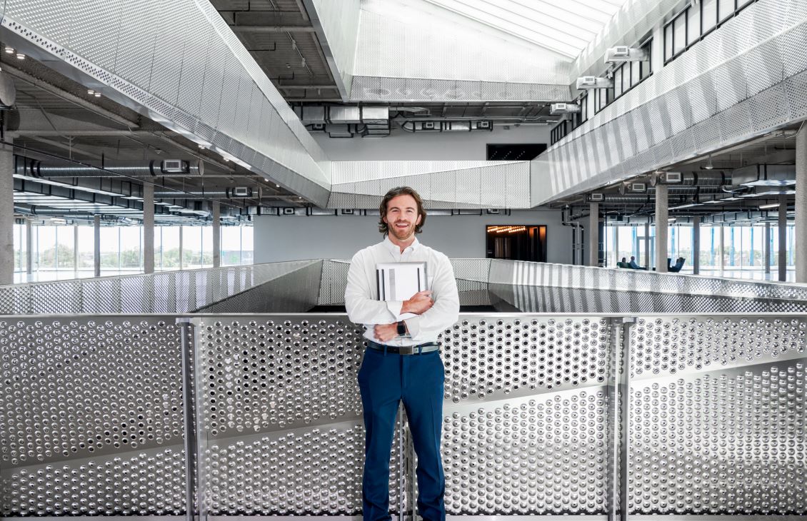 SLB employees standing in front of steel fence at Houston office