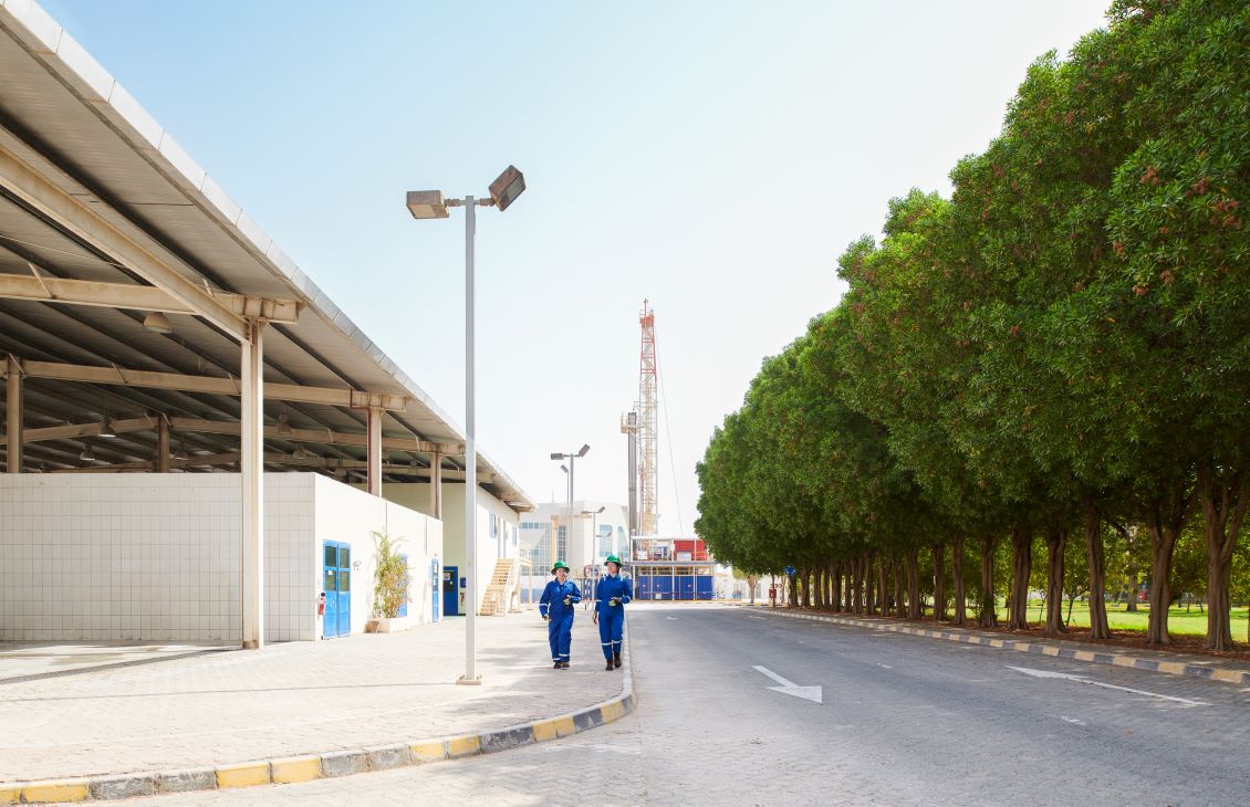 Two SLB employees walking on a sidewalk