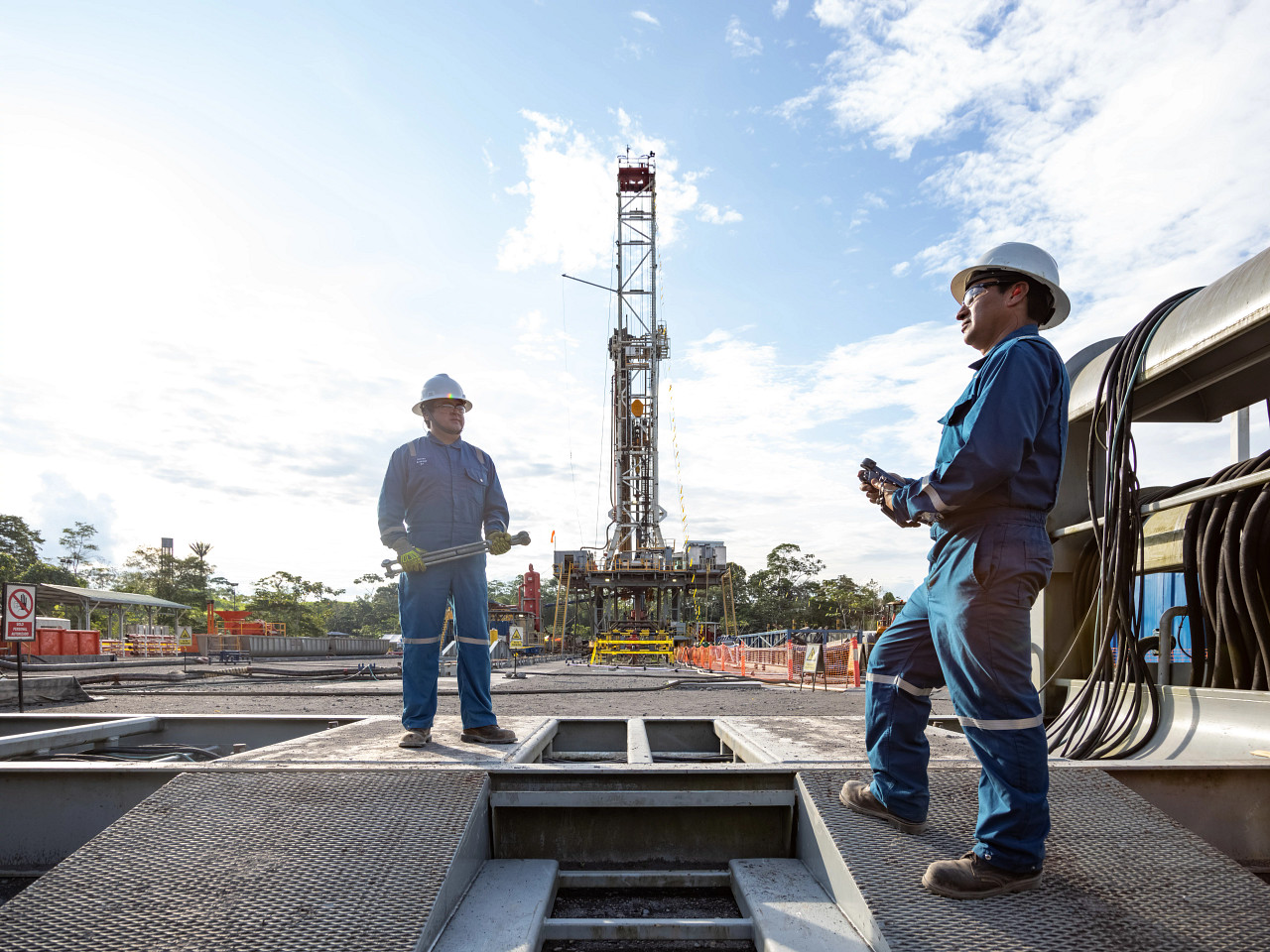 Two oil field engineers talking