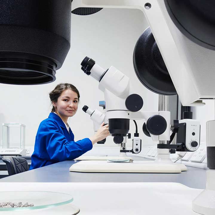 Photo of a woman working with microscope at the Learning Center in Abu Dhabi