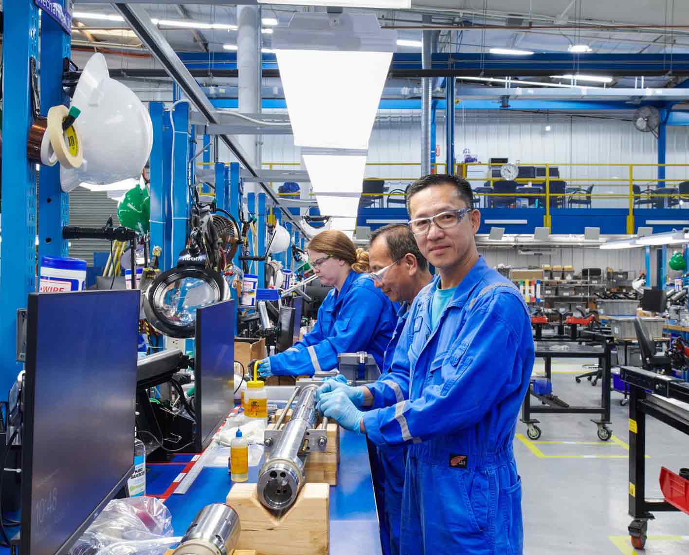 People working at manufacturing facility, Sugar Land, TX