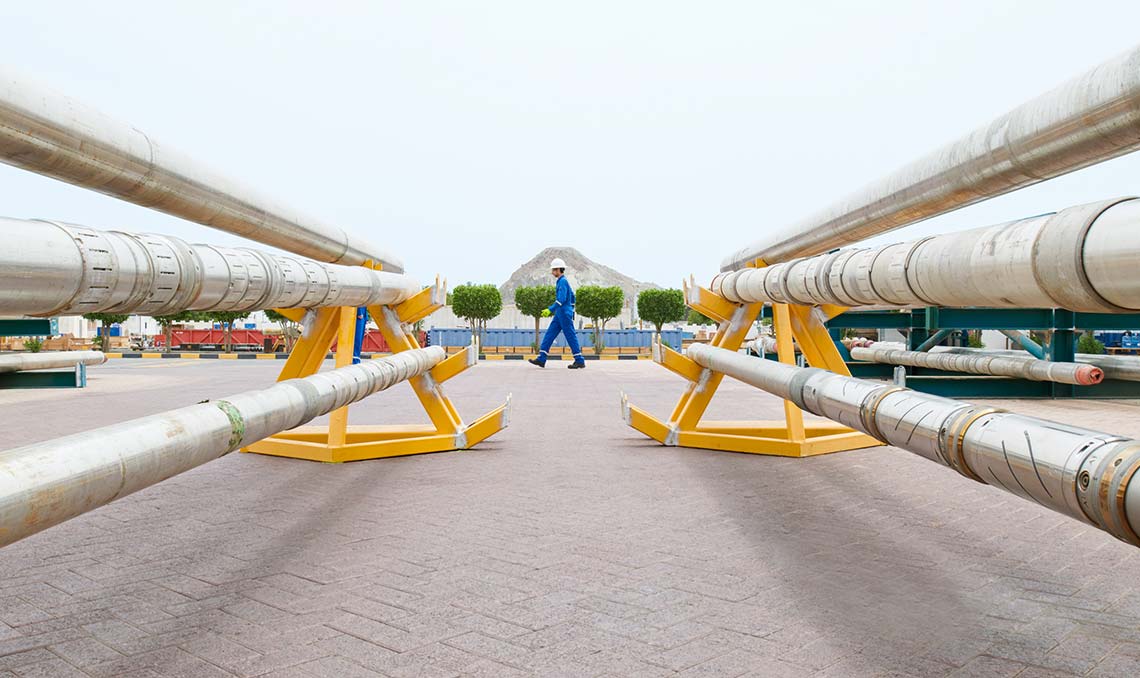 Employee walking outside of a Maintenance Facility in Oman (Tier 1_MaintenanceFacility_Oman_MENA_6117)